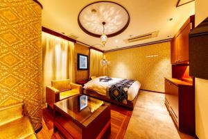 Postel nebo postele na pokoji v ubytování HOTEL Artia Izumiotsu (Adult Only)