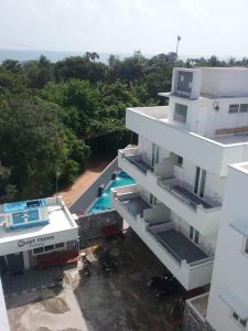 an aerial view of a building with a swimming pool at Quiet Home in Pondicherry
