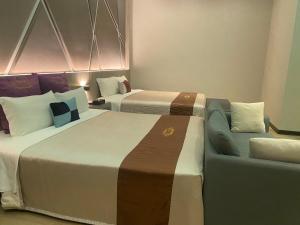 Letto o letti in una camera di Purple Rainbow Motel