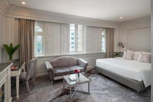 Postel nebo postele na pokoji v ubytování Kingston Suites Bangkok
