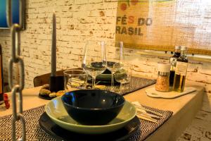 a table with a bowl and wine glasses on it at #thelittlebeauty in Linkenheim-Hochstetten
