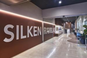 a lobby with a samsung sign on a wall at Silken Ramblas in Barcelona
