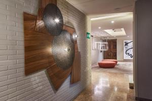 a room with a wall with a design on it at Silken Ramblas in Barcelona