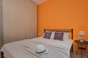 A bed or beds in a room at Gaia Beach House