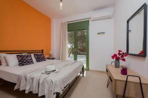 A bed or beds in a room at Gaia Beach House