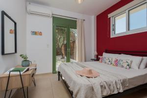 A bed or beds in a room at Gaia Beach House