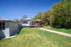 a home with a yard with a house at Rodova Cottage in Katoomba