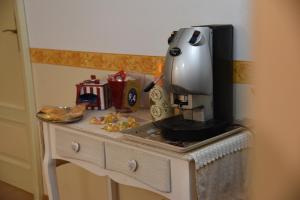 Kuchyň nebo kuchyňský kout v ubytování B&B The Queens