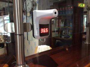 a digital clock on a counter in a bar at Ashley Hotel in Cork