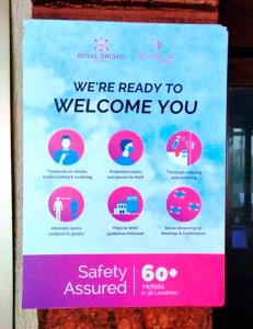 a sign that says were ready to welcome you at Regenta MPG Club Mahabaleshwar in Mahabaleshwar
