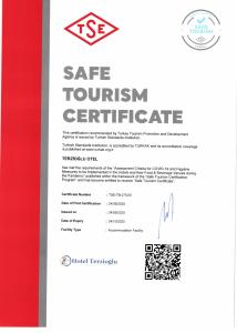 a certificate for a safe tourism certificate with a red ribbon at Terzioglu Otel in Hopa