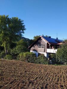 a house with a dirt field in front of it at Ferienwohnung Susanne & Georg Guth in Beilngries