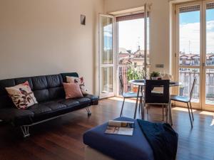 A seating area at The Best Rent - Bright two rooms apartment near Cattolica University