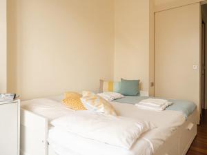 A bed or beds in a room at The Best Rent - Bright two rooms apartment near Cattolica University