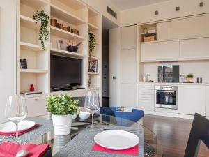 A kitchen or kitchenette at The Best Rent - Bright two rooms apartment near Cattolica University