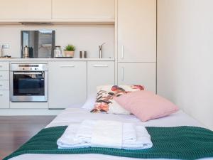 A kitchen or kitchenette at The Best Rent - Bright two rooms apartment near Cattolica University
