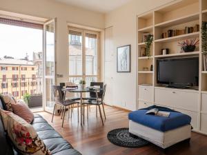 A television and/or entertainment centre at The Best Rent - Bright two rooms apartment near Cattolica University