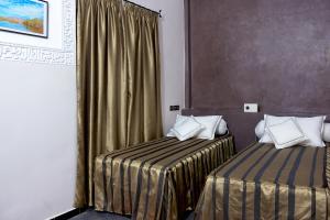 Postel nebo postele na pokoji v ubytování Hotel Azoul