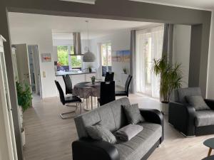 a living room with a couch and a table at Haus Malve Dahme in Dahme