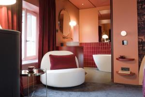 a room that has a toilet and a sink in it at MiHotel Tour Rose in Lyon