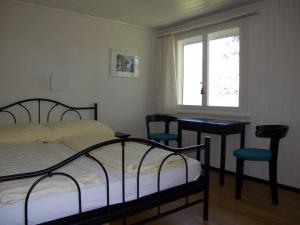 En eller flere senge i et værelse på Hotel Cafe Seeblick