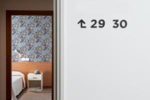 Postel nebo postele na pokoji v ubytování Hotel Rosa