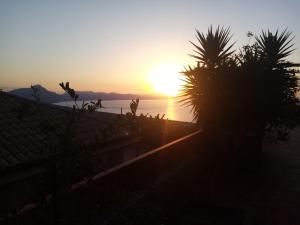 a sunset seen from the roof of a house at Villa Verde in Cefalù