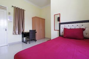 Una habitación de Surya Homestay Pekanbaru