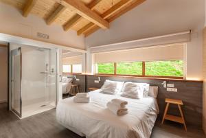 Postel nebo postele na pokoji v ubytování CieloAstur Complejo Turístico
