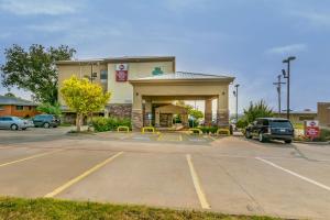 a parking lot in front of a gas station at Best Western Plus Shamrock Inn & Suites in Shamrock