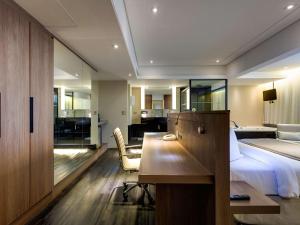 Cama ou camas em um quarto em Mercure Belo Horizonte Lourdes
