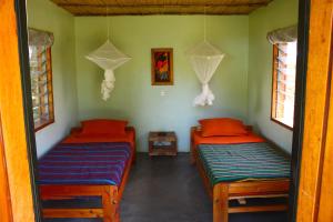 A bed or beds in a room at Red Chilli Rest Camp