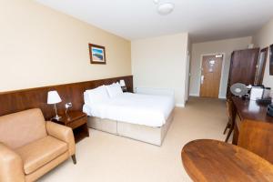 Ένα ή περισσότερα κρεβάτια σε δωμάτιο στο Strandhill Lodge and Suites Boutique Hotel