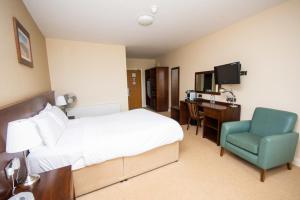 Ένα ή περισσότερα κρεβάτια σε δωμάτιο στο Strandhill Lodge and Suites Boutique Hotel