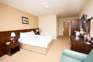 Ένα ή περισσότερα κρεβάτια σε δωμάτιο στο Strandhill Lodge and Suites Boutique Hotel