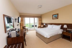 Ένα ή περισσότερα κρεβάτια σε δωμάτιο στο Strandhill Lodge and Suites Boutique Hotel