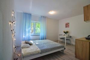 Posteľ alebo postele v izbe v ubytovaní Regem Apartments Płońska