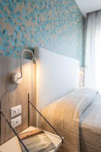 Postel nebo postele na pokoji v ubytování Hotel Rosa