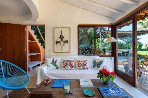 a living room with a couch and a table at Casas da Lia in Trancoso +39 photos