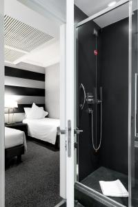Postel nebo postele na pokoji v ubytování Hotel Mancino 12