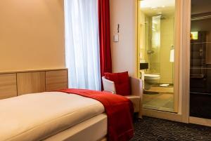 Postelja oz. postelje v sobi nastanitve Hotel St.Gotthard