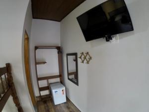 Ilha Grande Mar的电视和/或娱乐中心