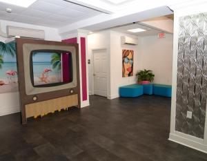 an empty room with a tv in a room at Aqua Beach Inn in Myrtle Beach