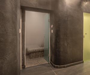 an open door to a room with a bed in it at Glyfada Riviera Hotel in Athens