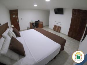 Hotel Caquetá Real HSC客房内的一张或多张床位