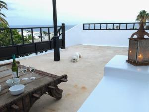 A balcony or terrace at Villa Mare Bella Chao sea view private heated solar pool AC