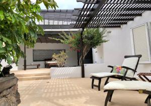 A patio or other outdoor area at Villa Mare Bella Chao sea view private heated solar pool AC