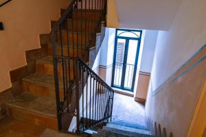 
a stairway leading up to a room with stairs at In Riva Al Lago in Como
