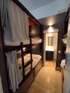 a group of bunk beds in a room at Ant Hostel Barcelona in Barcelona