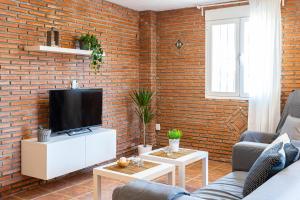 TV a/nebo společenská místnost v ubytování Apartamento Alberti